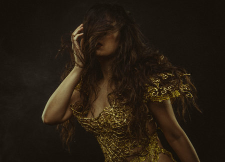 Golden armor, brunette goddess dressed in gold lace dress. concept deity and faith