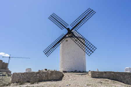 Landscape windmills of Consuegra in Toledo, Spain. They served to grind grain crop fieldsの写真素材