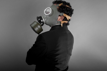 Smoke, Businessman with gas mask, concept business dangerous for the environment or for societyの写真素材