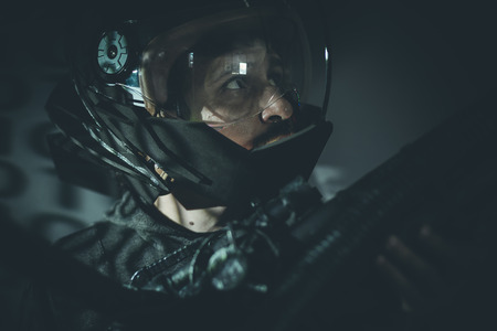 Space man with metal helmet and laser beam weaponの写真素材