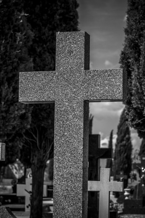 Cemetery, details of crosses and tombs with sculptures of jesus christ and angels in spainの写真素材