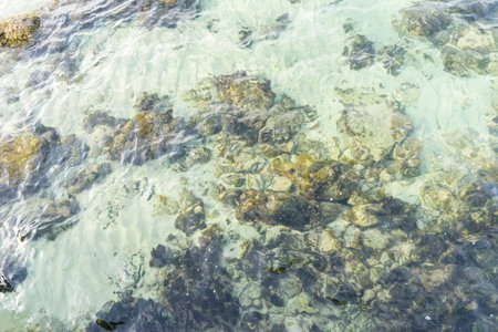 Rocks by the sea with waves of the Mediterranean sea next to the Cabo de Formentor in the Balearic Islands, Spain. Scenes of Spanish tourismの写真素材