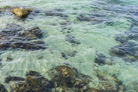Rocks by the sea with waves of the Mediterranean sea next to the Cabo de Formentor in the Balearic Islands, Spain. Scenes of Spanish tourismの写真素材