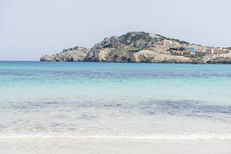 Rocks by the Mediterranean sea on the island of Ibiza in Spain, holiday and summer sceneの写真素材