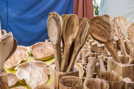 Kitchen utensils made of wood, spoons, forks, spatulas, gastronomy fairの写真素材