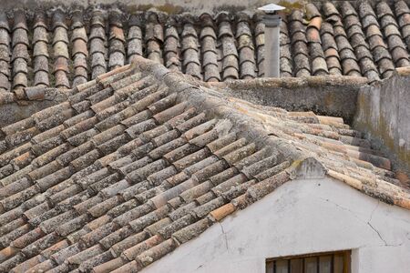 Classic tile roof, Chinchon, Spanish municipality famous for its old medieval square of green color, medieval village tourismの写真素材