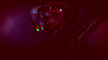 Spaceman, man of the future or space with futuristic helmet and fantasy lights, carries a laser...