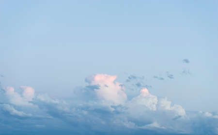Evening, Sky with clouds and sunlight at sunset. colorful and cheerful, wallpaper or textureの写真素材