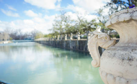 Gardens of the city of Aranjuez, located in Spain. Stone palace and beautiful autumn landscapes with beautiful fountains and mythological figuresの写真素材