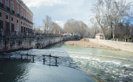 Gardens of the city of Aranjuez, located in Spain. Stone palace and beautiful autumn landscapes with beautiful fountains and mythological figuresのeditorial素材