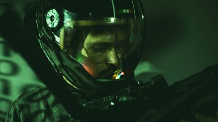 cyborg man of the future with helmet lights led and huge laser gunの写真素材