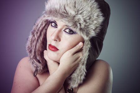 beautiful nude woman with furry winter hat girl coldの写真素材