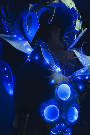 blue corset made by hand with plastic pieces and blue colored LEDs. robot of the future with space and futuristic helmetの写真素材
