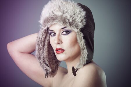 beautiful nude woman with furry winter hat girl coldの写真素材