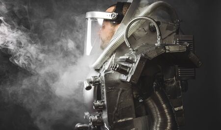 Exploration astronaut, space man's costume made with cardboard and pieces of recycling, imagination and creativityの写真素材