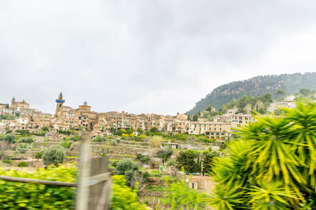 rustic, flowerpots street in the tourist island of Mallorca, Valdemosa city in Spainの写真素材