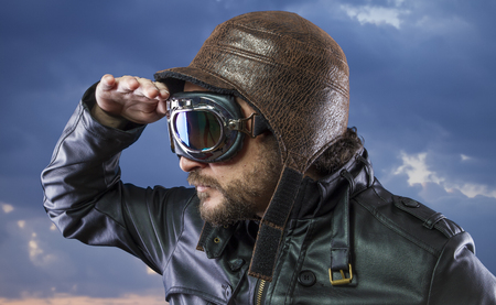 Chopper old motor driver, man with sunglasses leather jacket with expressive faces on storm clouds backgroundの写真素材