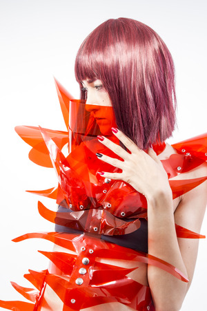Cosplay, Asian woman cosplayer with futuristic costume in red, made with pvc plastics and transparencies. oriental girlの写真素材