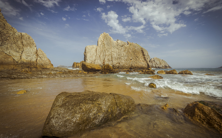 Beach with rocks in summer. Playa de la ArnÃ­a in Santander, Spainの写真素材
