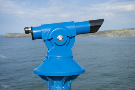Coin operated binocular on the summer beach, tourist scene in Spainの写真素材