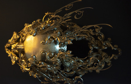 golden skull made with 3d printer and pieces by hand. Gothic piece of decoration for halloween or horror scenesの写真素材