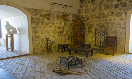 Interior of a medieval castle in Toledo, Spain. Stone rooms with wooden furniture, medieval period of the Spanish reignのeditorial素材