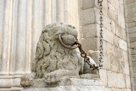 Intricate Lion Sculpture Guarding Ãvila Cathedral in Spainの写真素材