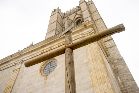 Cross in Front of Ãvila Cathedral: A Symbol of Faithの写真素材