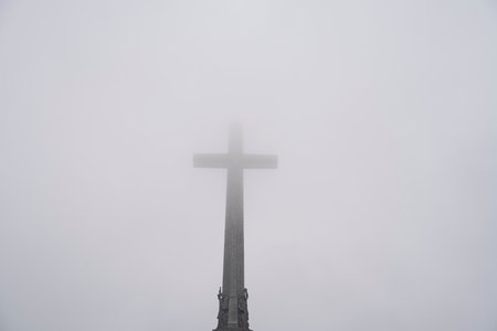 Majestic Valley of the Fallen with Cross Shrouded in Fogの写真素材