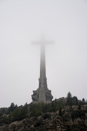 Foggy View of the Valley of the Fallen with Monumental Cross in Spainの写真素材