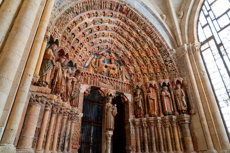 Visitors admire the stunning facades and ornate sculptures of Colegiata de Santa Maria la Mayor de...