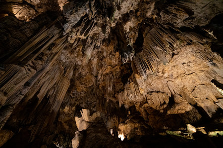 Visitors marvel at the breathtaking formations of stalactites and stalagmites in the caves of...