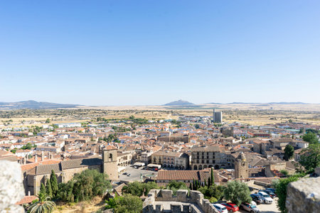 Visitors admire the rich historical landscape of Trujillo, Extremadura, showcasing ancient...