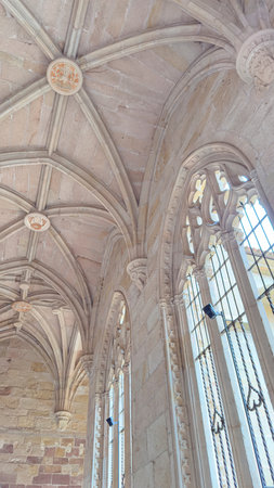 Visitors admire the stunning interior of Cathedral of Porquenza in Spain, featuring detailed gothic...
