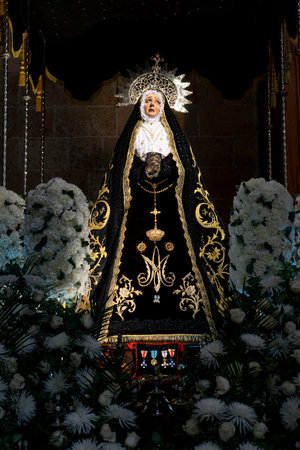 Virgin Mary Statue Surrounded by Flowers in Segovia, Spain