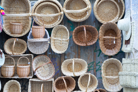 Assorted Handwoven Baskets Displayed on a Wallの写真素材