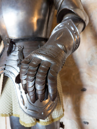 A close-up of a metallic armored glove., handの写真素材