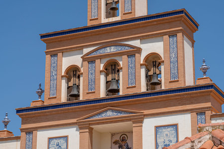 Colorful church tower with bells and tiles.. MÃ¡laga, Spain, blueの写真素材