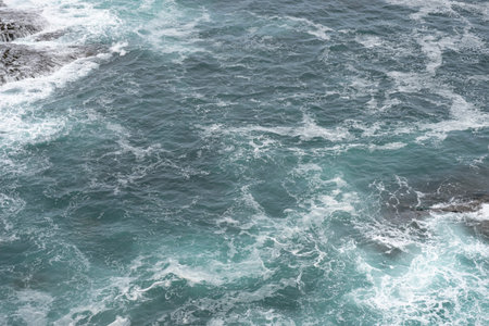 Waves crashing on rocky shore in coastal area. Santander, Spain, ocean