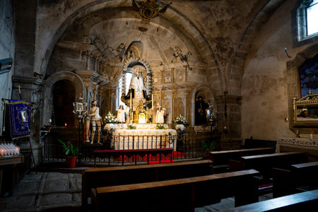 Interior of a church with an altar and pews.. Parish Church of Our Lady of the Assumption in La Alberca, Salamanca, Spain, lightの写真素材