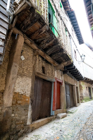 Narrow street with rustic buildings and wooden balconies.. streets of the municipality of La...