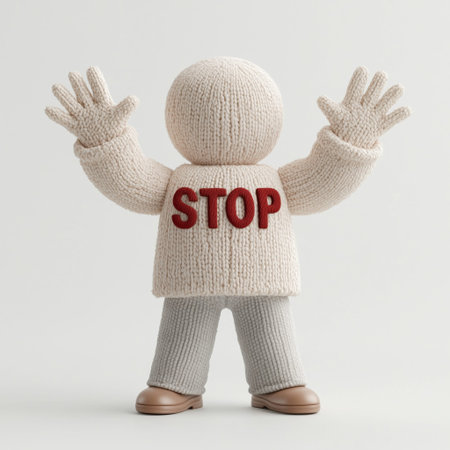 Knitted figure with raised hands wearing stop sweater.の素材