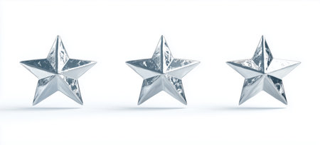 Three metallic stars in minimalist arrangement on white background.の素材