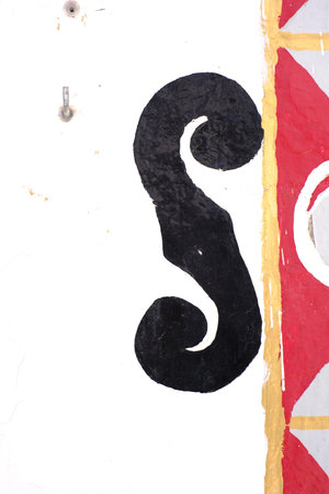 Bold artistic patterns featuring black swirl on white with red and gold accents.の写真素材