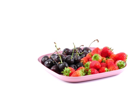 strawberry and cherry in pink plateの写真素材