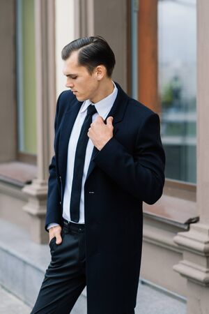Man in a stylish suit. Businessman in an autumn cityの写真素材