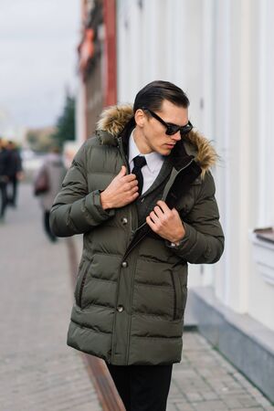 Man in a stylish suit. Businessman in an autumn cityの写真素材