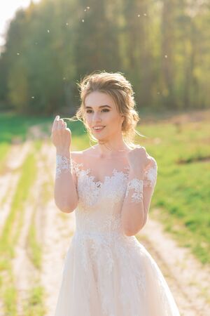Young beautiful woman in blooming garden.の写真素材