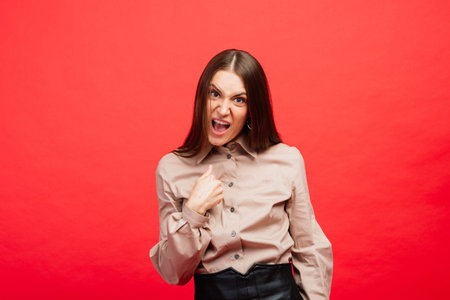 Cheerful and joyful young female playing with protective medical mask and blue gloves on red background. Close-up portrait. End of coronavirus quarantine, isolation. Covid-2019, Pandemic 2020の写真素材