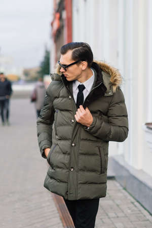 Man in a stylish suit. Businessman in an autumn cityの写真素材